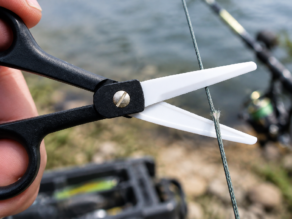 Why Do Fishing Scissors Slip on Braided Line?