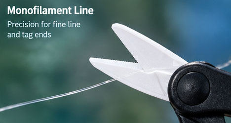 Ceramic fishing scissors cutting a thin monofilament fishing line