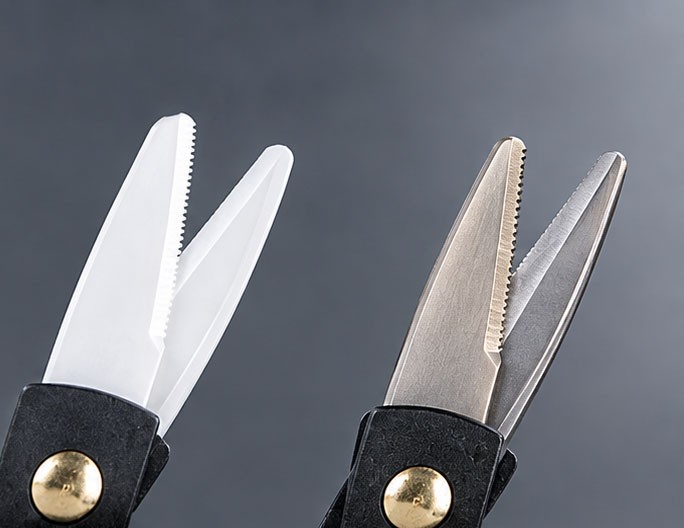 White ceramic scissor blades compared with metallic fishing scissor blades